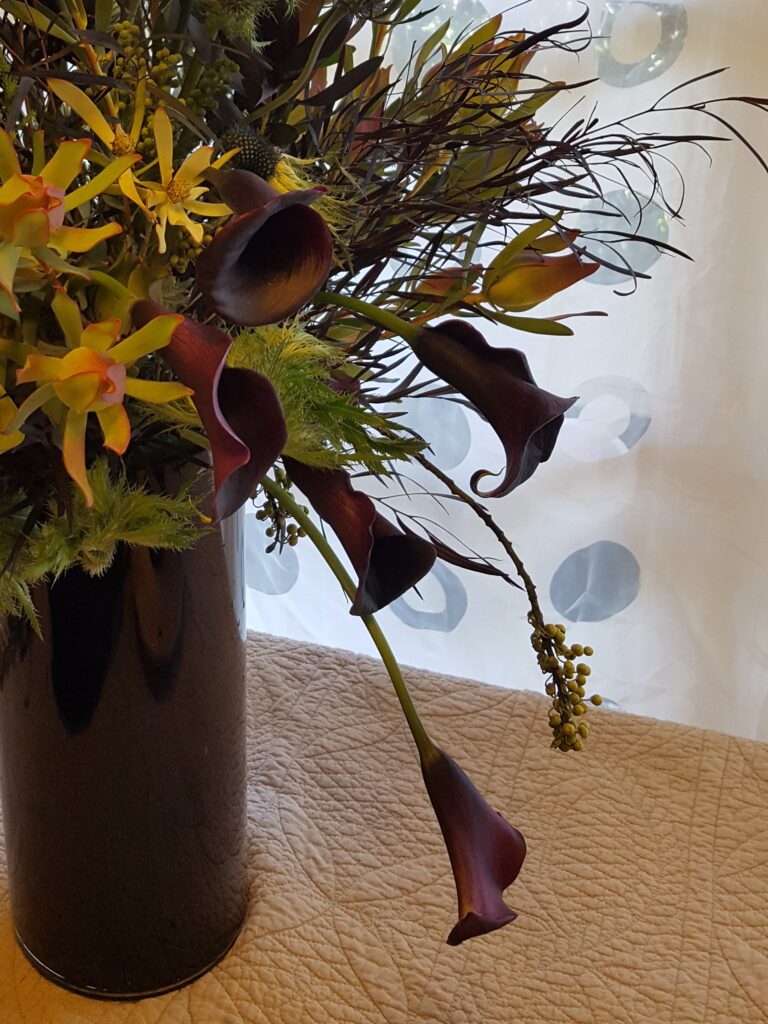 Dark calla lily arrangement
