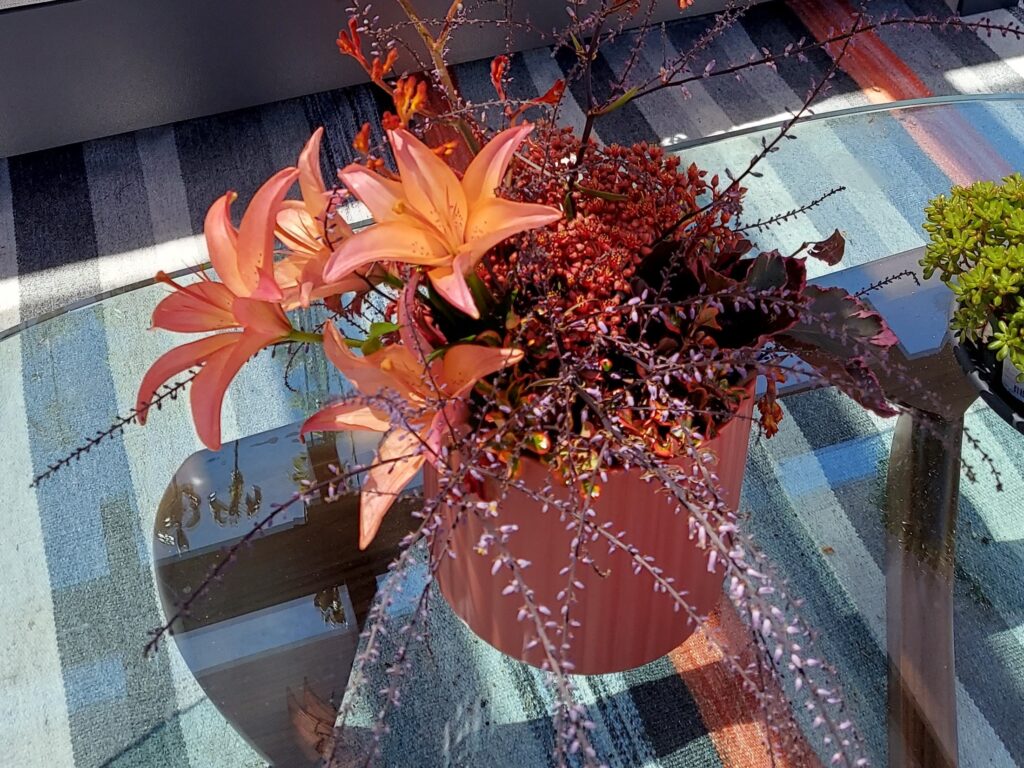 Arrangement with orange lilies